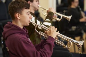 boy playing trumpet