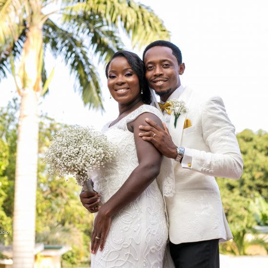 bride and groom smiling for photograph