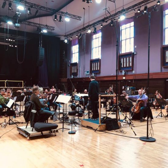 group of musicians performing in a hall